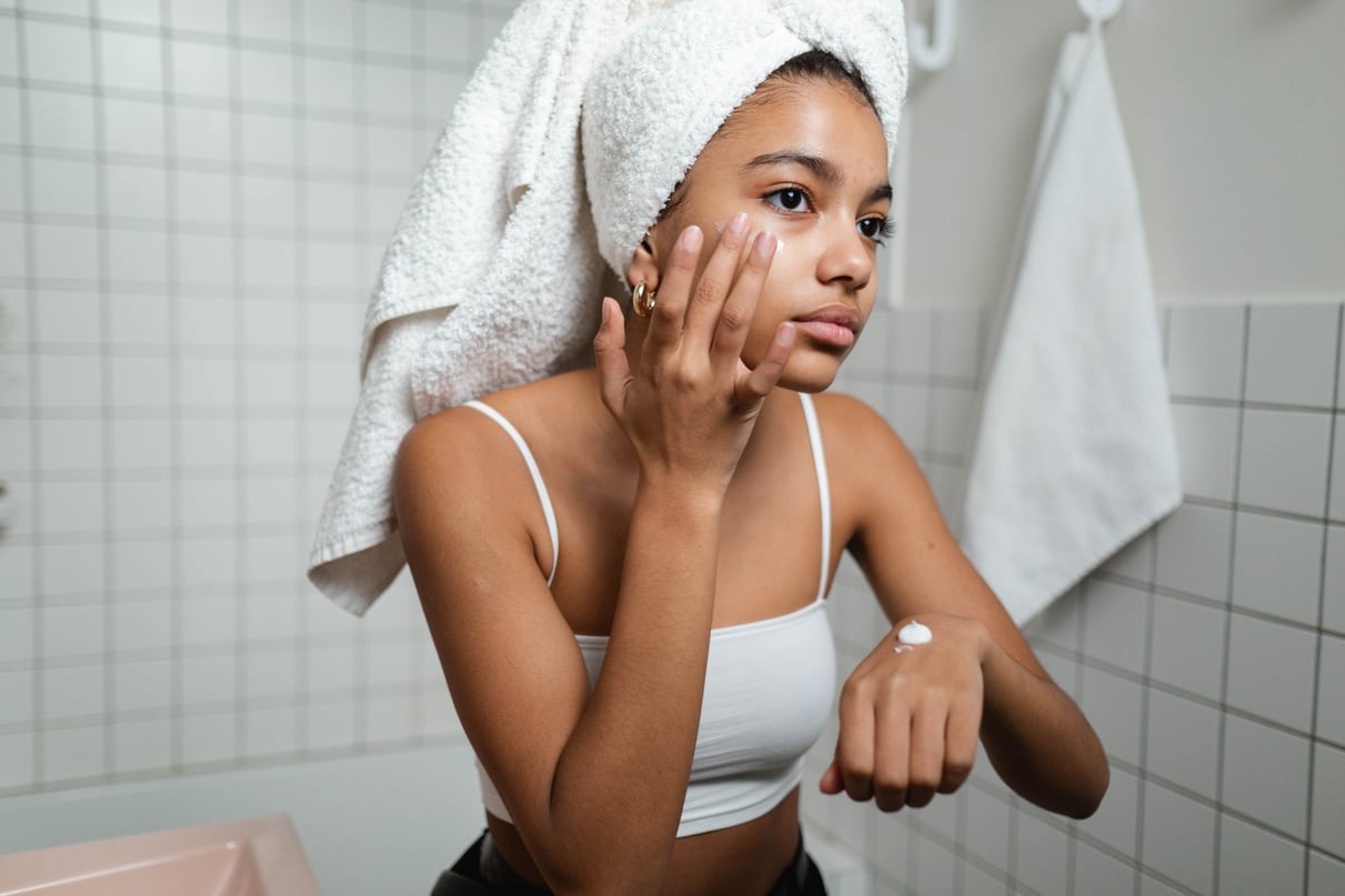 Woman Applying Face Cream 